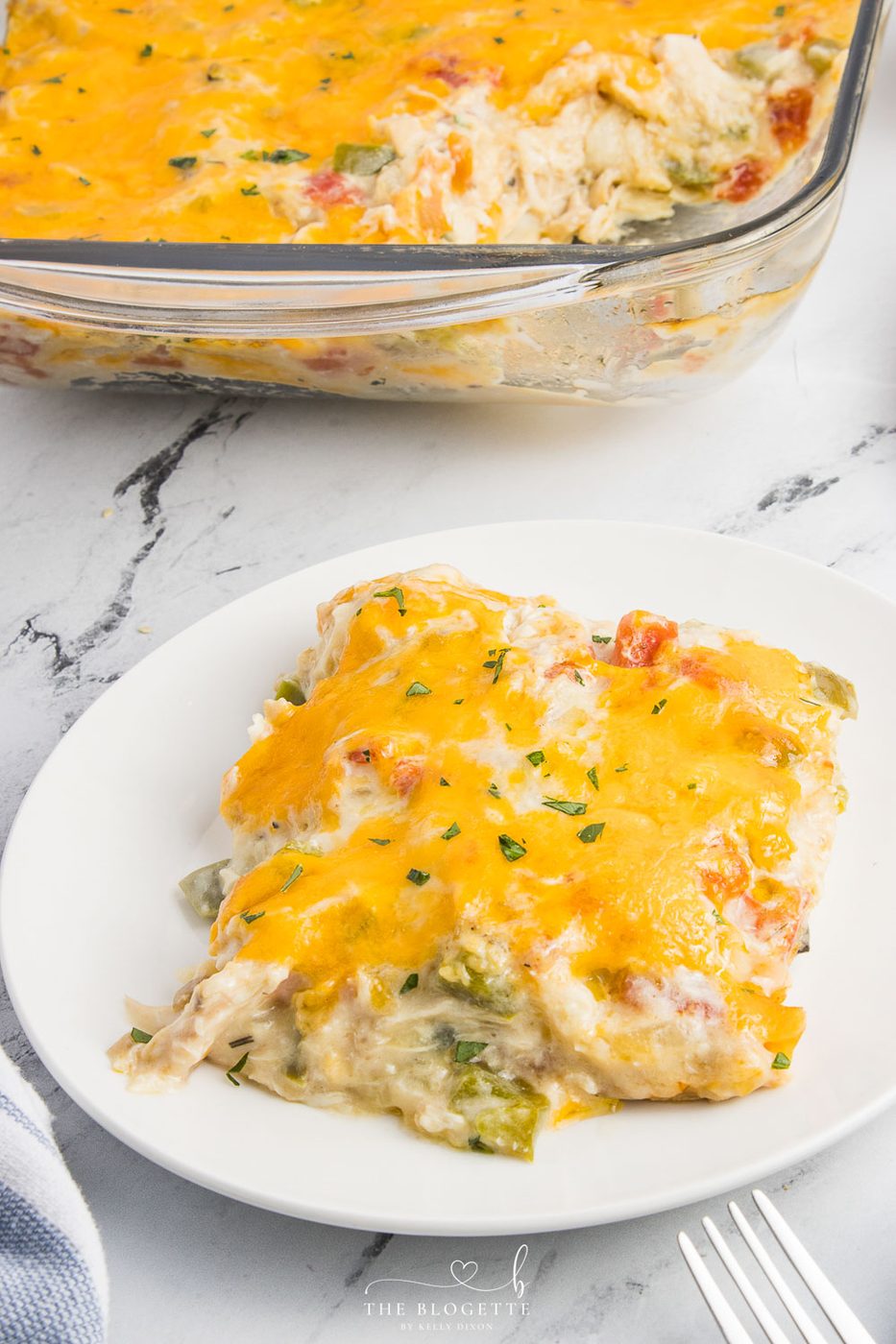 King Ranch Chicken Casserole is a combination of chicken, cheese, veggies, and corn tortillas in a rich and creamy sauce.