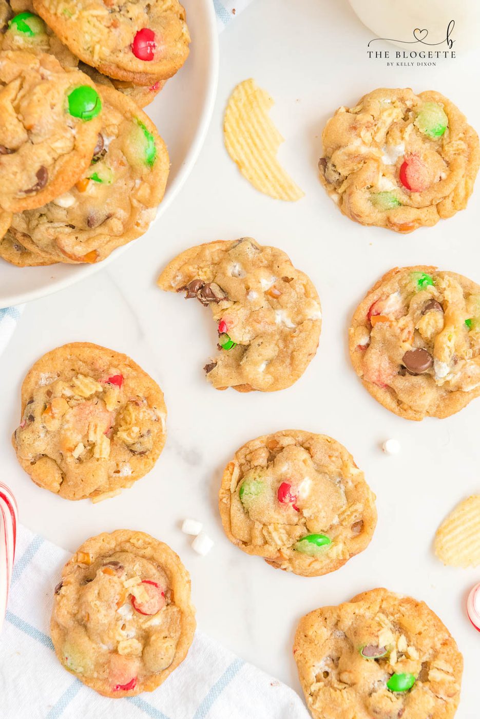 Kitchen Sink Christmas Cookies are sweet-and-salty, chewy-and-soft-centered cookies with M&M's, chocolate chips, pretzels, marshmallows, potato chips... everything but the kitchen sink!