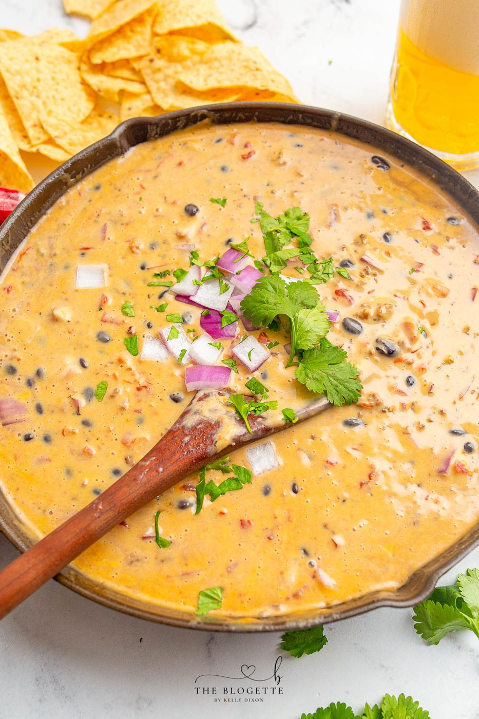 Loaded Queso Dip is full of flavor, packed with beef, beans, cheese, and even beer! Well-balanced appetizer with chips at parties or on game day!