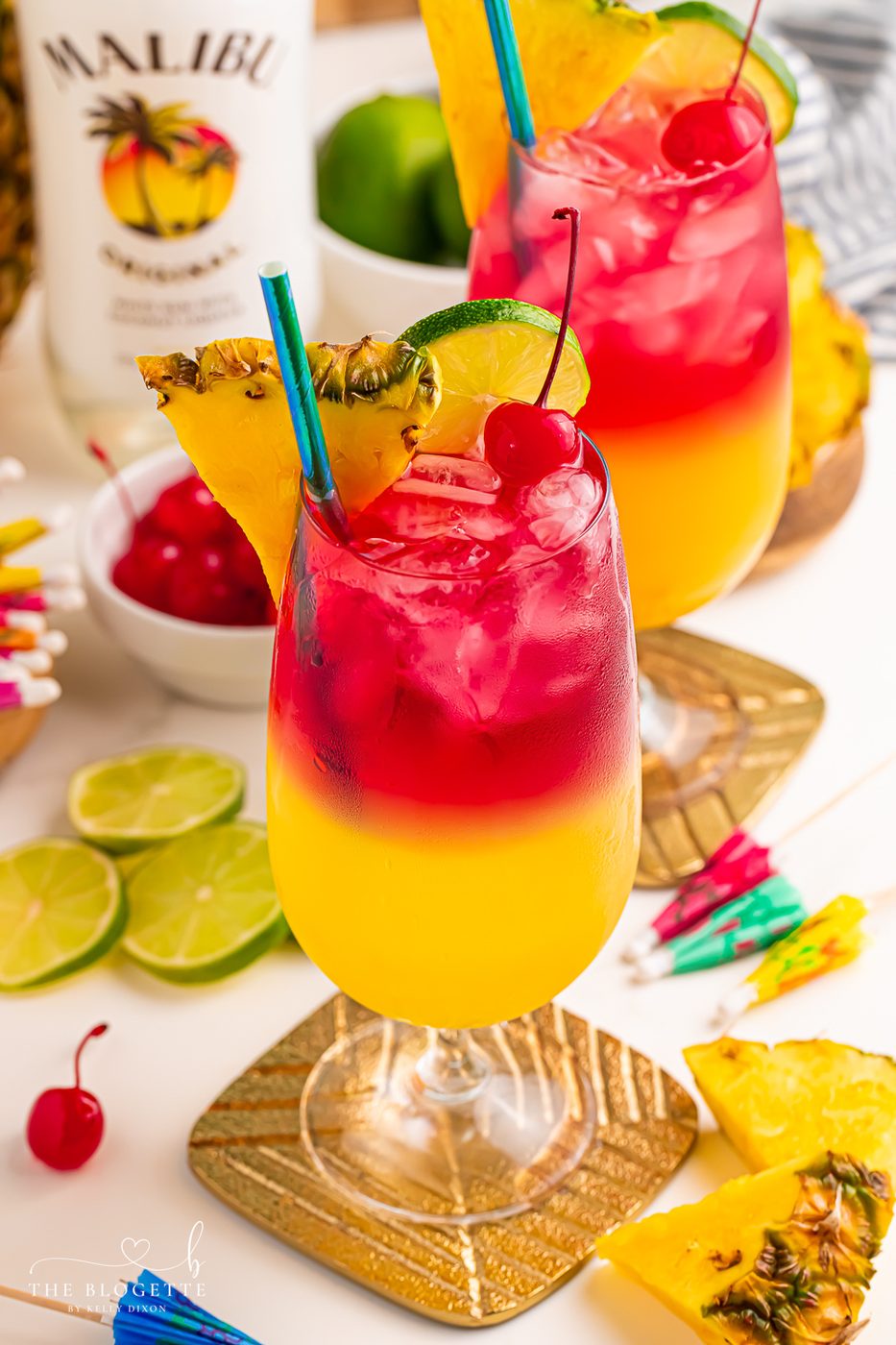 Make a beautiful Malibu Bay Breeze cocktail by layering pineapple juice, Malibu rum, and cranberry juice! Well-balanced all spring and summer long!