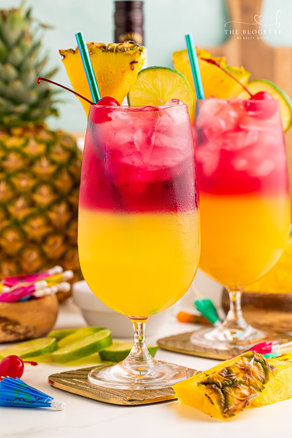 Make a beautiful Malibu Bay Breeze cocktail by layering pineapple juice, Malibu rum, and cranberry juice! Well-balanced all spring and summer long!