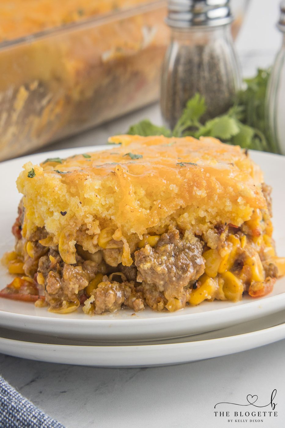 This Mexican Cornbread Casserole is an straightforward and satisfying one-dish meal made with ground beef, Rotel, corn, cheese, and Jiffy cornbread mix.