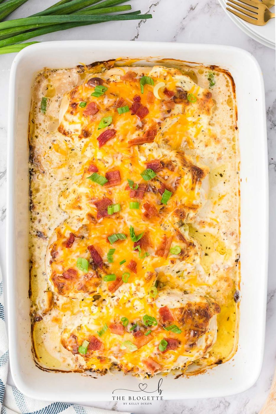 This Million Dollar Chicken recipe is straightforward, cheesy, and smothered in a special cream sauce, then topped with bacon!