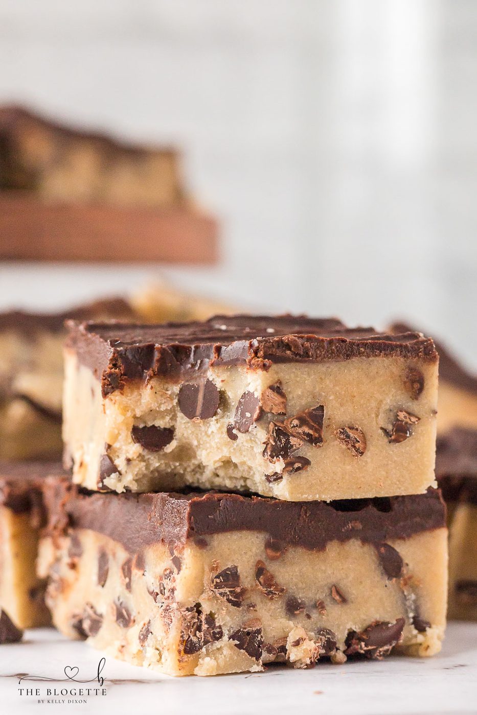 No-Bake Chocolate Chip Cookie Bars are irresistible, fun to make, and safe to eat! Simply put the bars in the refrigerator, chill, and enjoy!