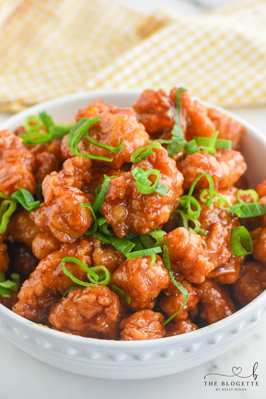 Orange Chicken that's made with 4 ingredients! Tasty bites of chicken covered in a sweet and flavorful orange sauce. 30-minute dinner recipe!