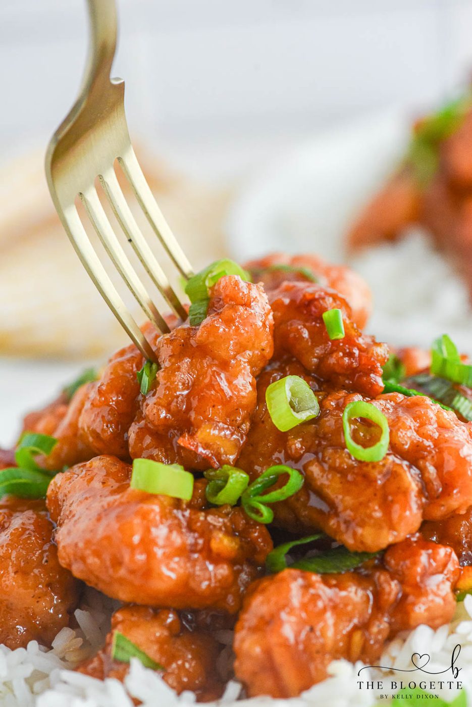 Orange Chicken that's made with 4 ingredients! Tasty bites of chicken covered in a sweet and flavorful orange sauce. 30-minute dinner recipe!