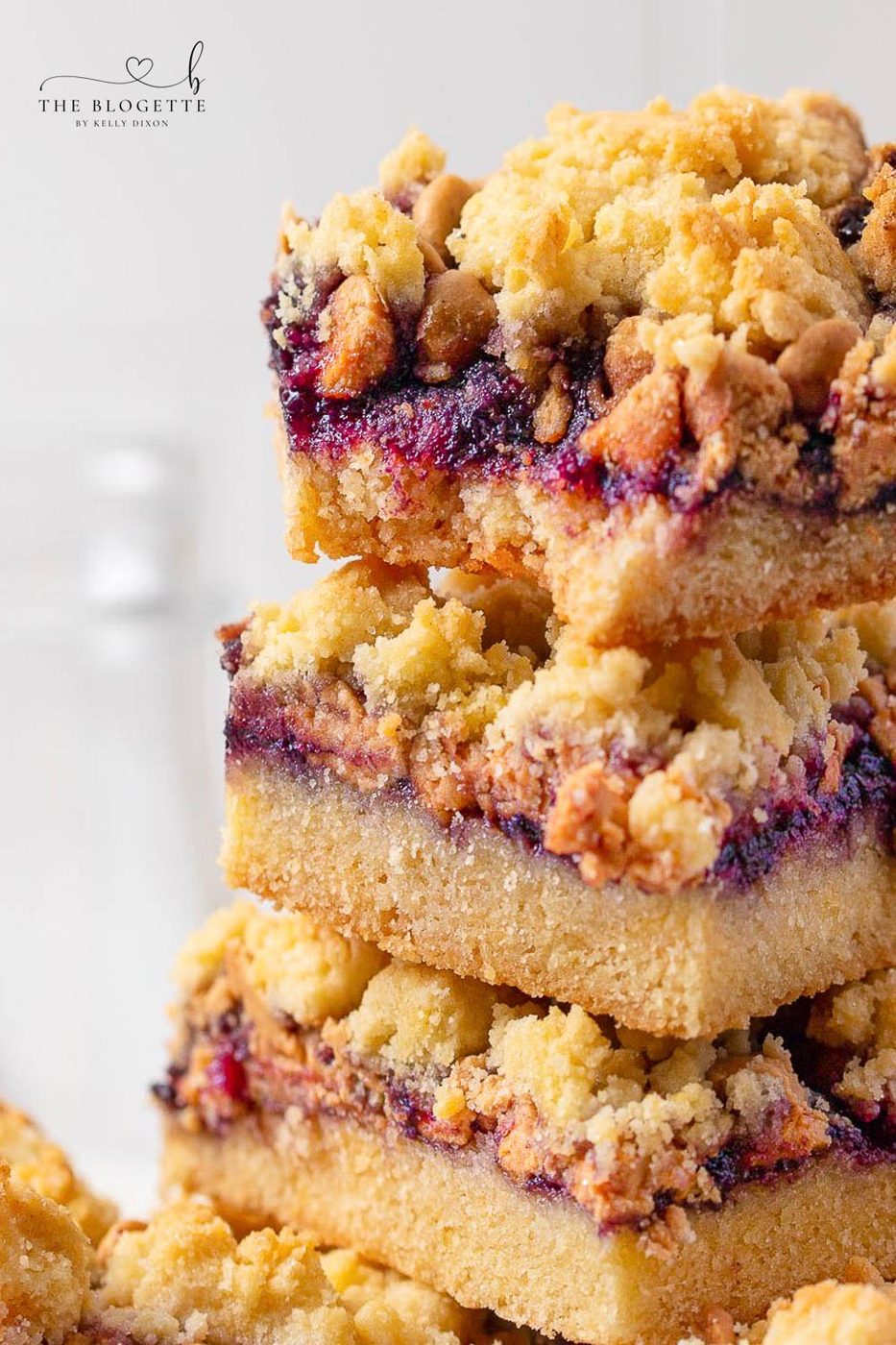 Peanut Butter and Jelly Cookie Bars - Made with your favorite peanut butter pieces, these PB&J Bars turn a classic sandwich into a tasty cookie treat!