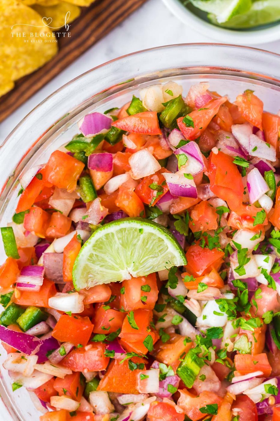 From-scratch Pico de Gallo is so fresh and straightforward to mix! Featuring fresh tomatoes, jalapeños, onions, cilantro, and more.