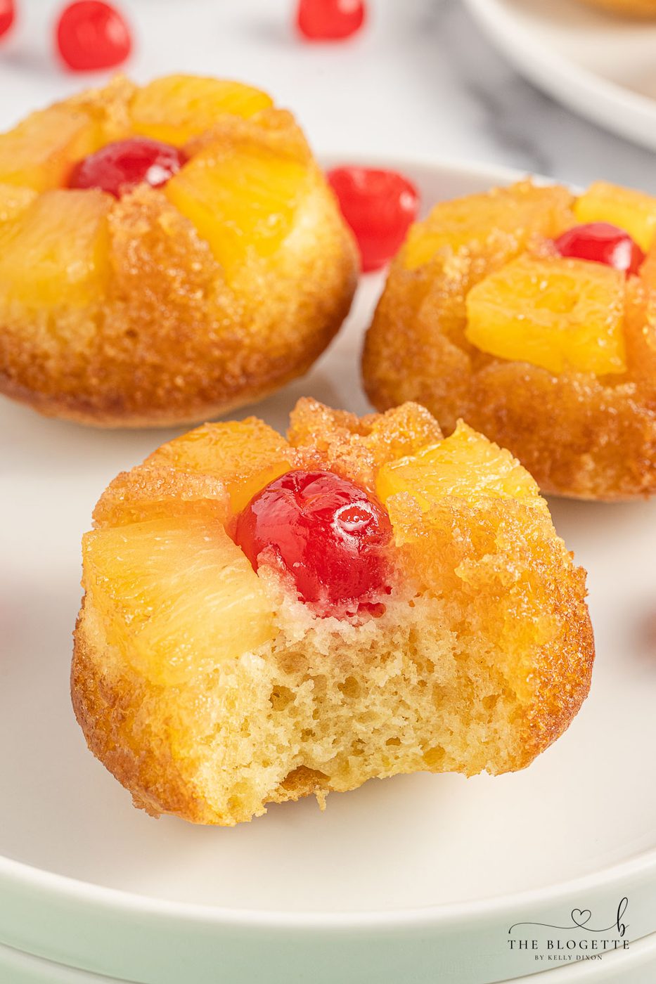 Straightforward Pineapple Upside Down Cupcakes Recipe! Soft, buttery sweet cupcakes with a tender top, tender pineapple pieces, and cherry on top.