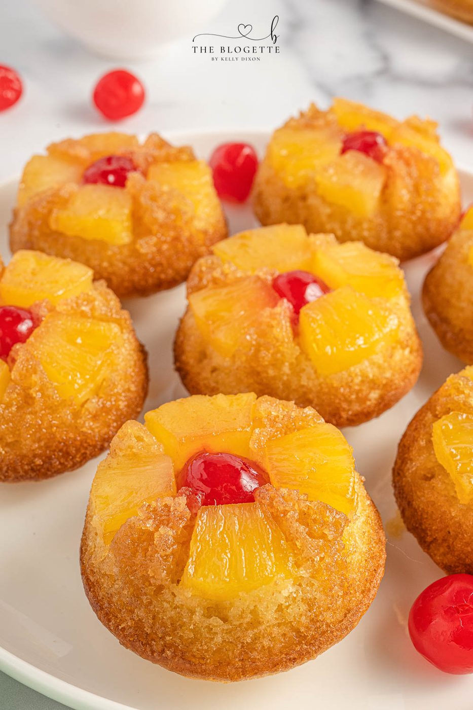 Straightforward Pineapple Upside Down Cupcakes Recipe! Soft, buttery sweet cupcakes with a tender top, tender pineapple pieces, and cherry on top.