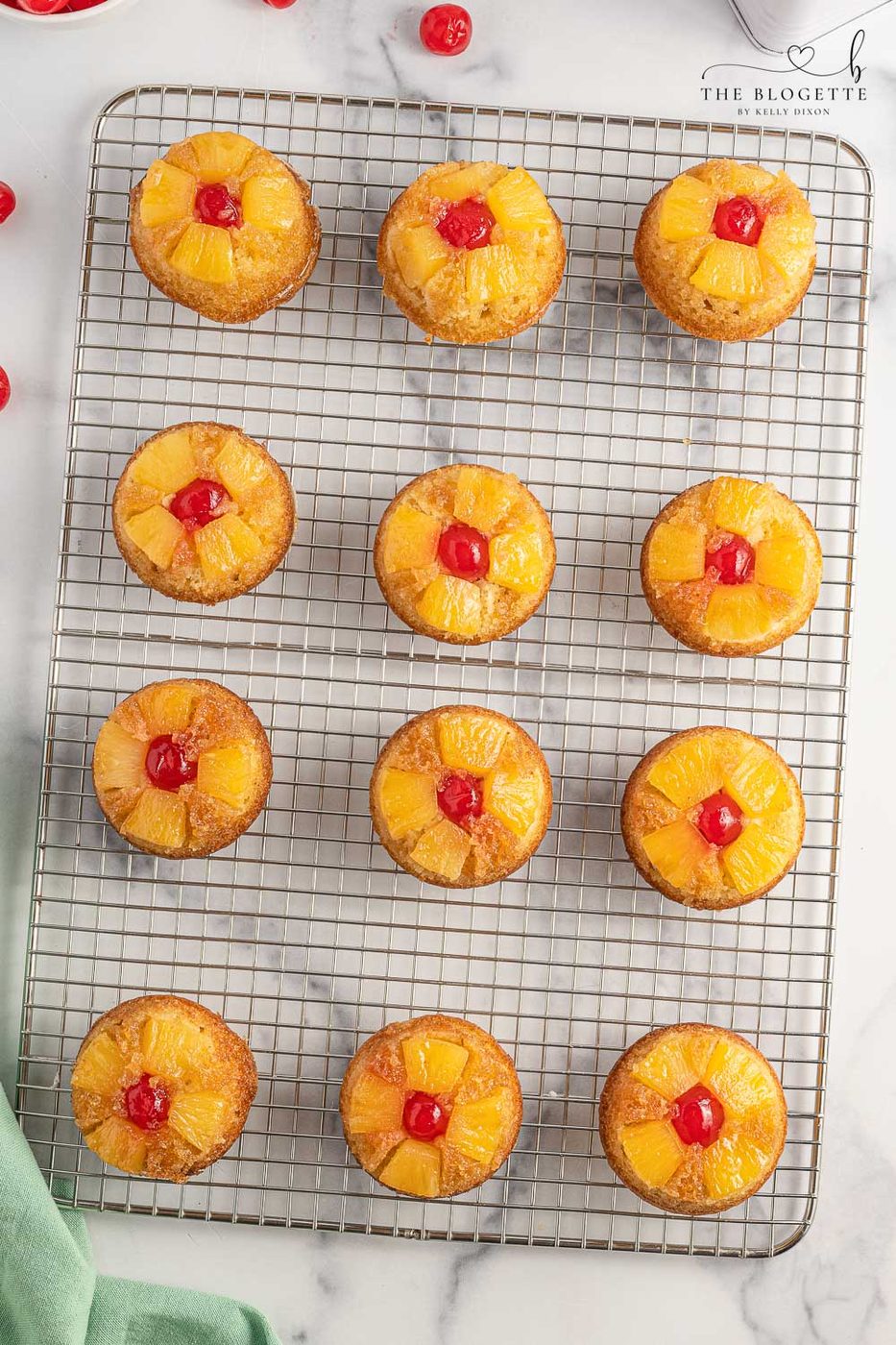 Straightforward Pineapple Upside Down Cupcakes Recipe! Soft, buttery sweet cupcakes with a tender top, tender pineapple pieces, and cherry on top.