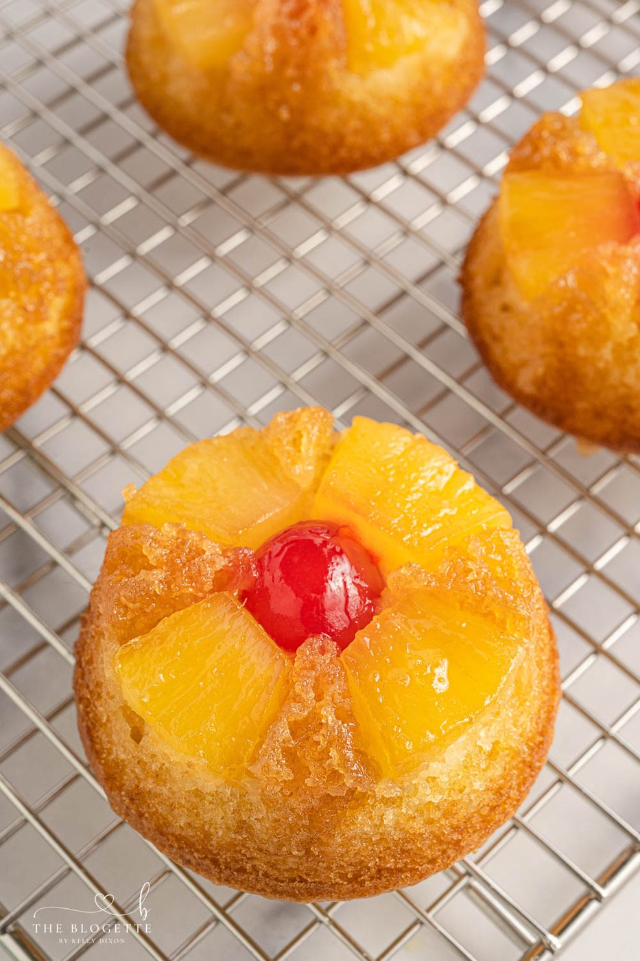 Straightforward Pineapple Upside Down Cupcakes Recipe! Soft, buttery sweet cupcakes with a tender top, tender pineapple pieces, and cherry on top.