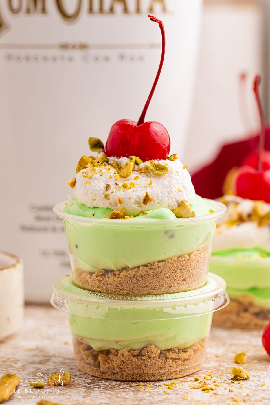 These creamy Pistachio Pudding Shots are the cutest party dessert! Made with pistachio pudding mix, RumChata, Cool Whip, and graham cracker topping. Well-balanced for holiday parties, girls’ night, St. Patrick’s Day treats, and straightforward no-bake desserts. Save this RumChata pudding shot recipe!