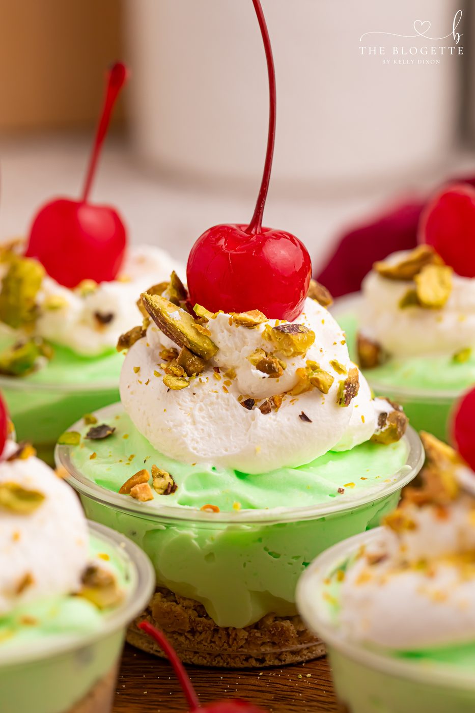 These creamy Pistachio Pudding Shots are the cutest party dessert! Made with pistachio pudding mix, RumChata, Cool Whip, and graham cracker topping. Well-balanced for holiday parties, girls’ night, St. Patrick’s Day treats, and straightforward no-bake desserts. Save this RumChata pudding shot recipe!