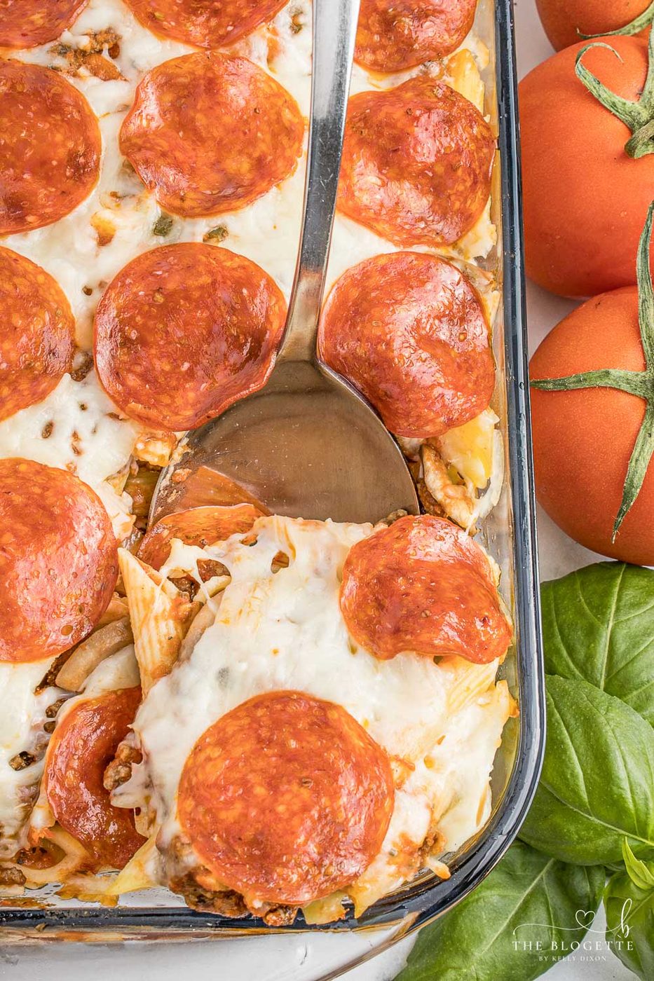 Pizza casserole has layers of pasta, sauce, and ooey-soft-centered cheese, along with your favorite pizza toppings.