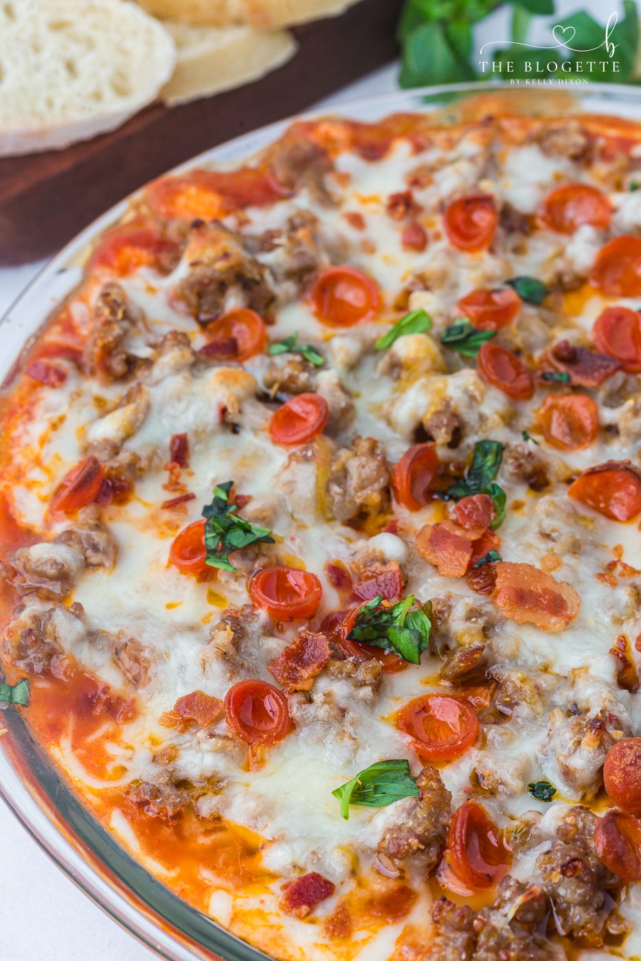 This straightforward Pizza Dip recipe is loaded with cream cheese, Italian sausage, mozzarella, and mini pepperonis for a soft-centered, crowd-pleasing appetizer everyone will love.