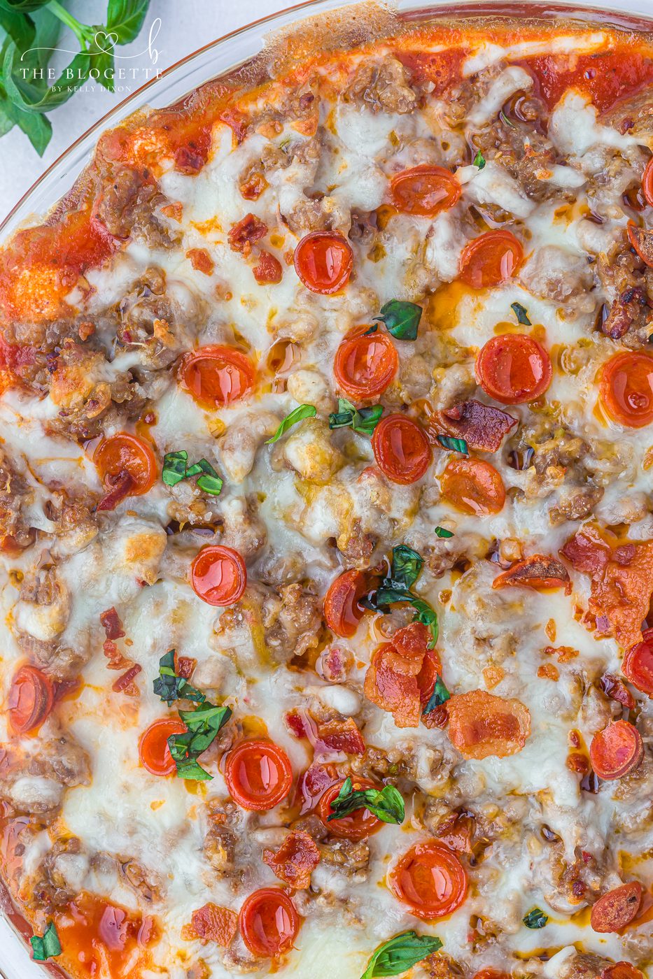 This straightforward Pizza Dip recipe is loaded with cream cheese, Italian sausage, mozzarella, and mini pepperonis for a soft-centered, crowd-pleasing appetizer everyone will love.