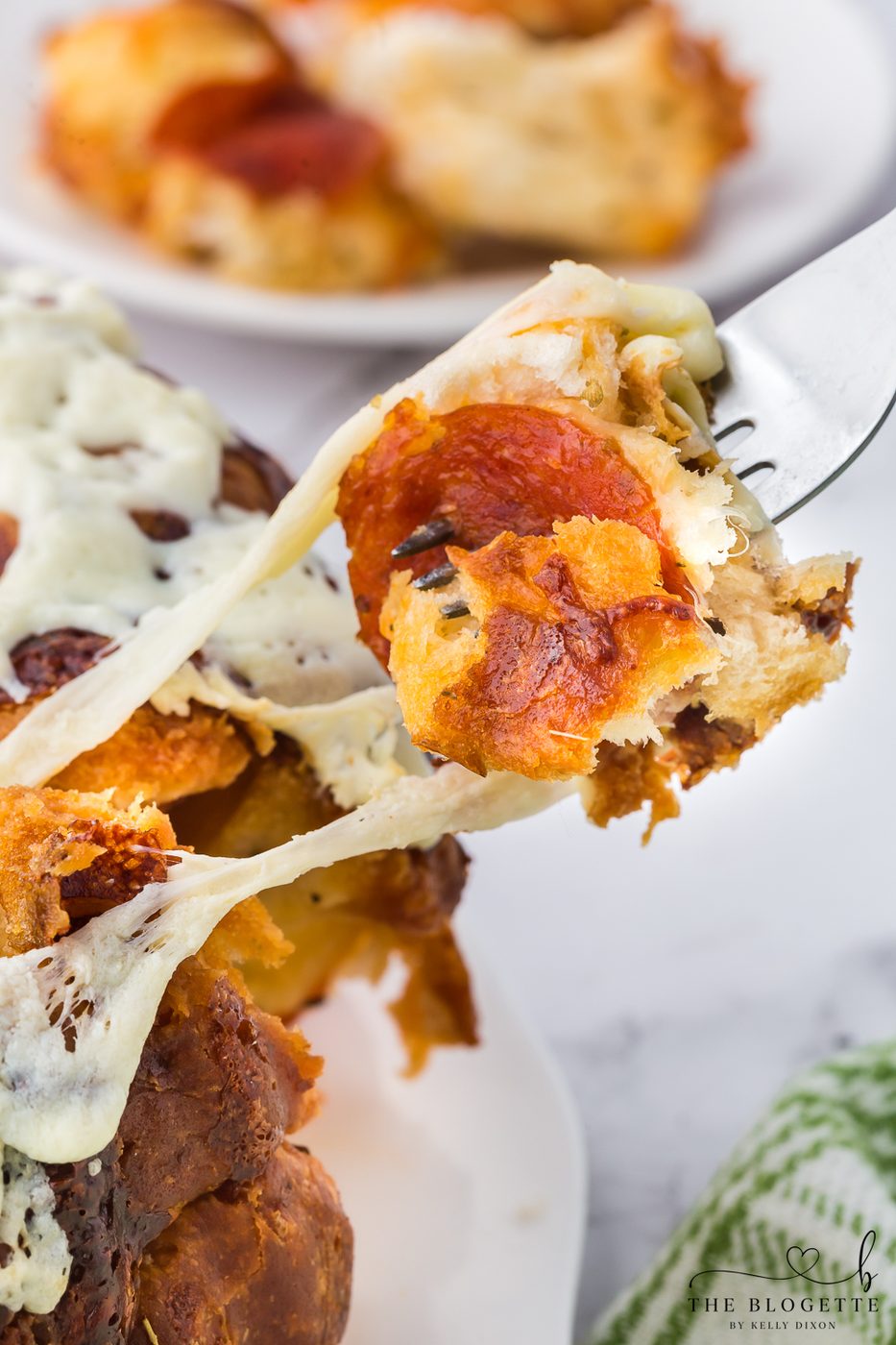 Straightforward Pull-Apart Pizza Bread! It has the well-balanced combination of melted cheese and pepperoni.