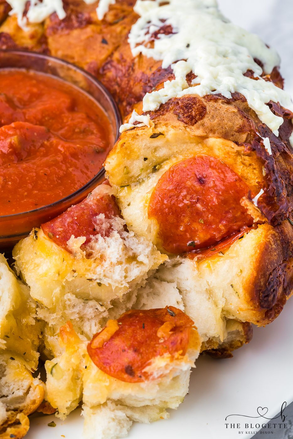 Straightforward Pull-Apart Pizza Bread! It has the well-balanced combination of melted cheese and pepperoni.