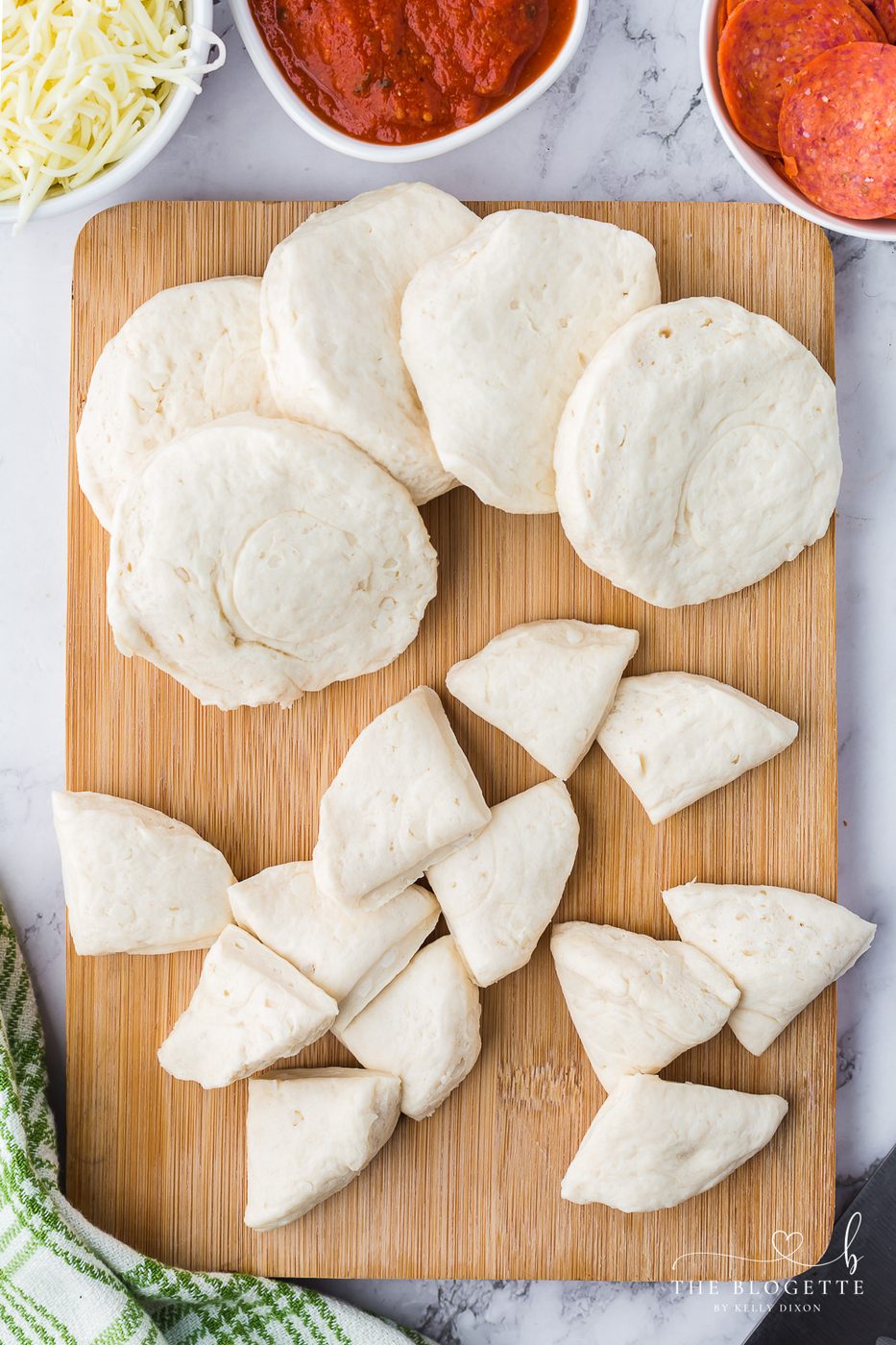Cut the biscuits into quarters