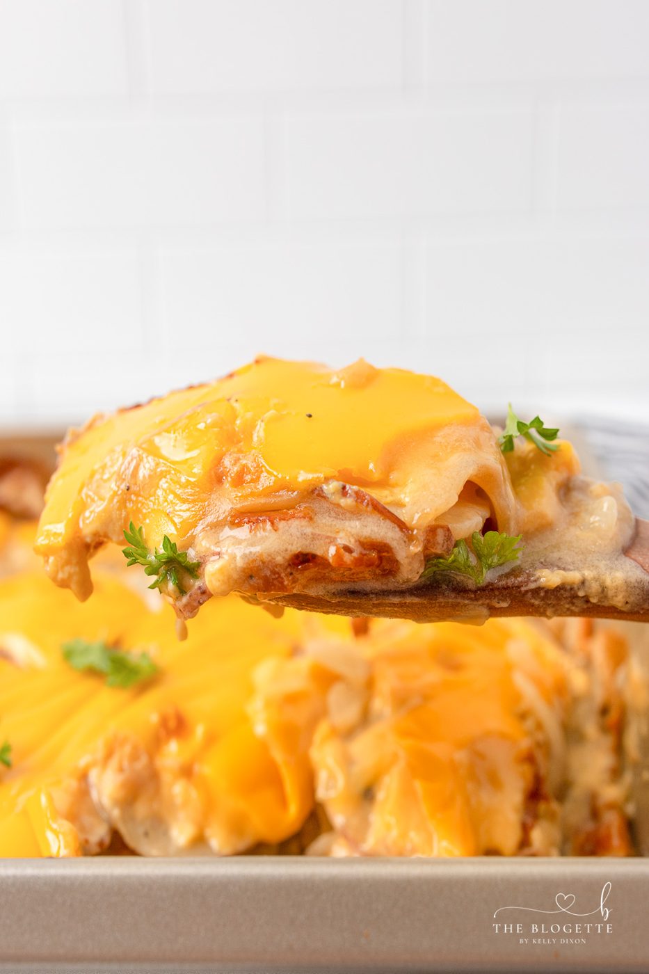 Potatoes Au Gratin are a dinnertime staple around here! Tender potato slices smothered in an addicting cheesy sauce. Au gratin is the ultimate comfort food.