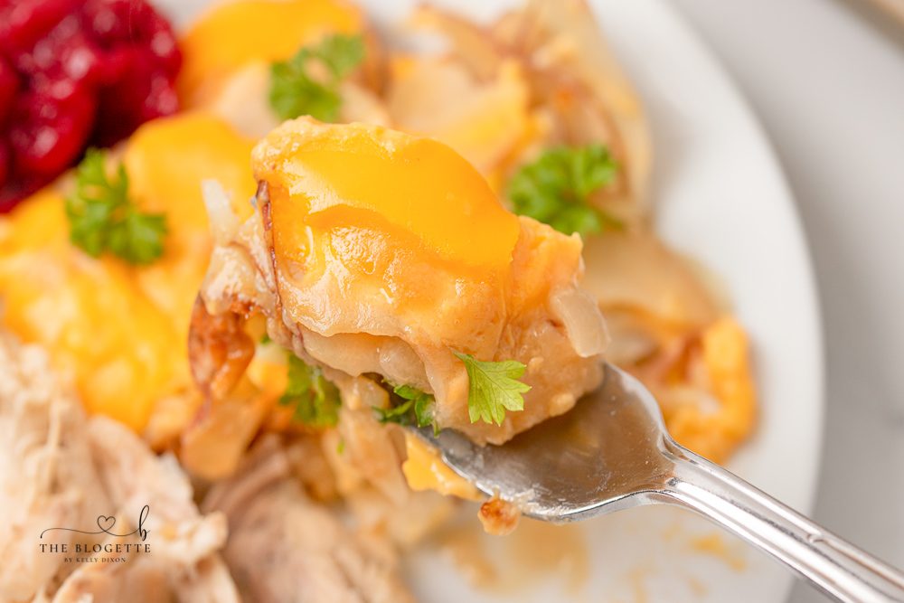 Potatoes Au Gratin are a dinnertime staple around here! Tender potato slices smothered in an addicting cheesy sauce. Au gratin is the ultimate comfort food.