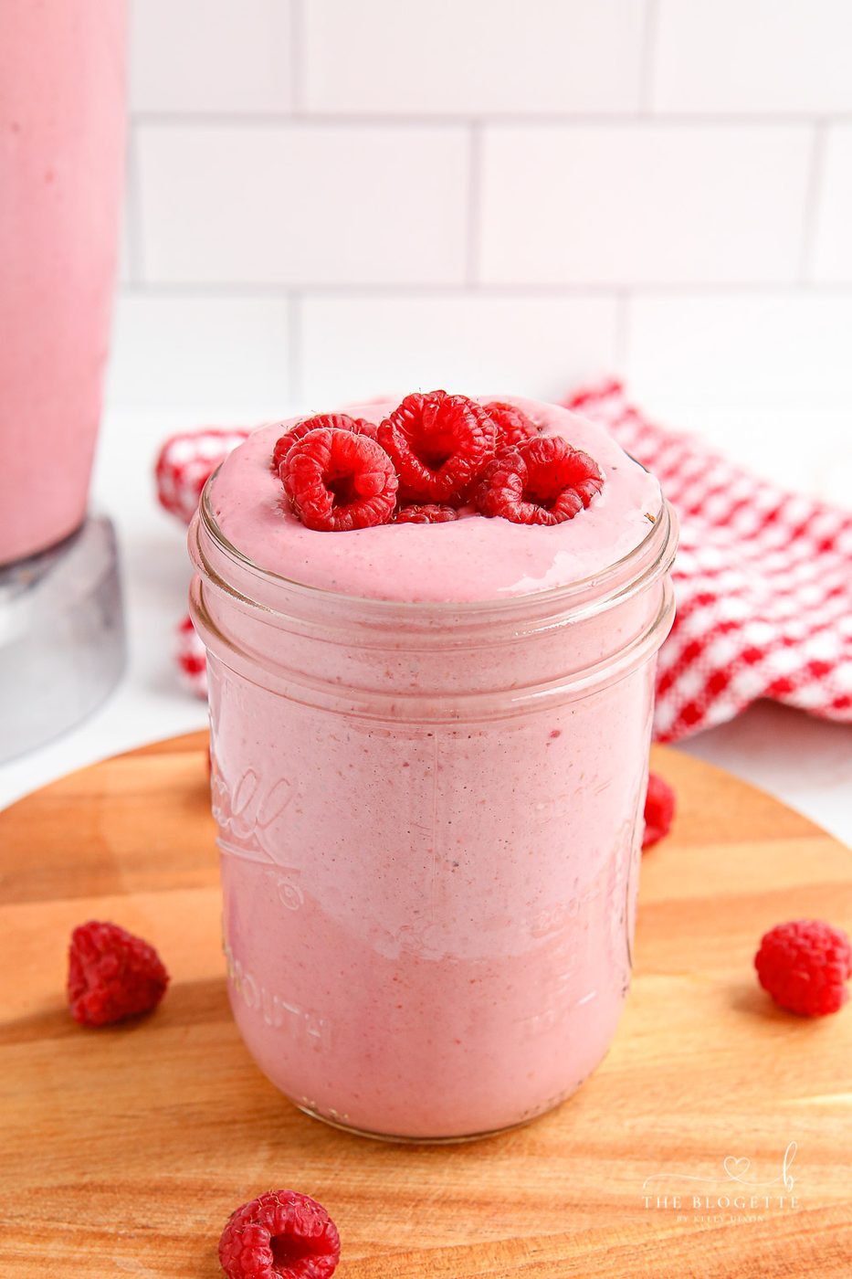 Ultra-smooth and creamy Raspberry Smoothie recipe! While it tastes like ice cream, this smoothie is a lighter way to sneak fruit and grains into your day!