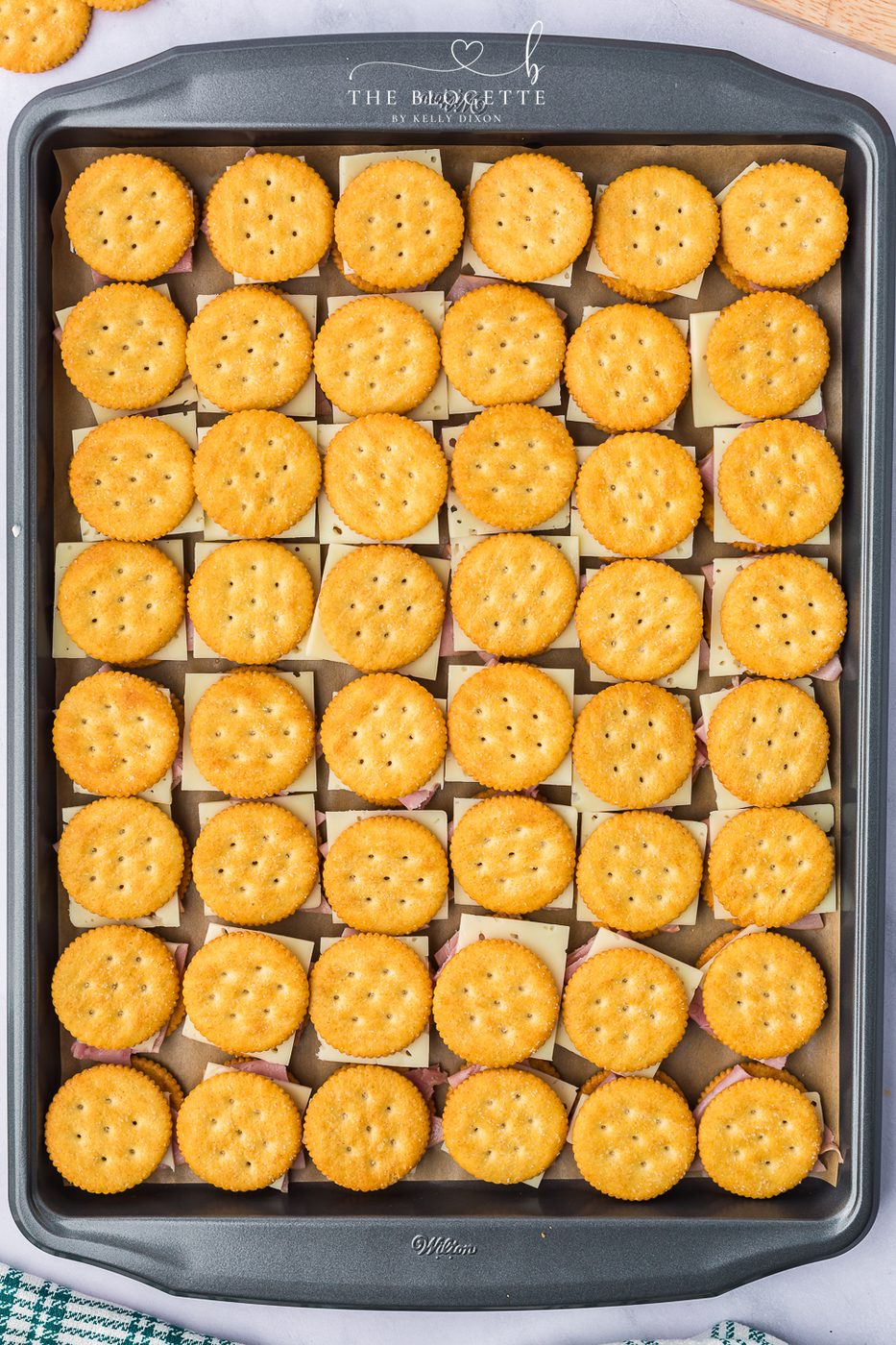Cover the sandwich with another butter cracker cracker