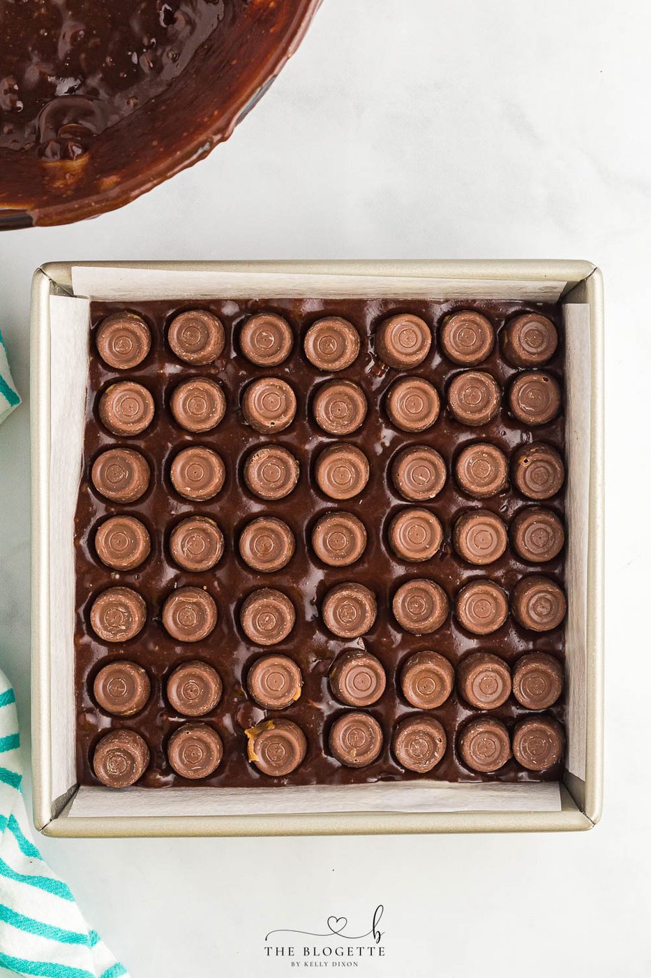 Fudgy satisfying Rolo Brownies are an unbelievable ooey-soft-centered satisfying dessert. A must-bake treat that is straightforward to mix from scratch!