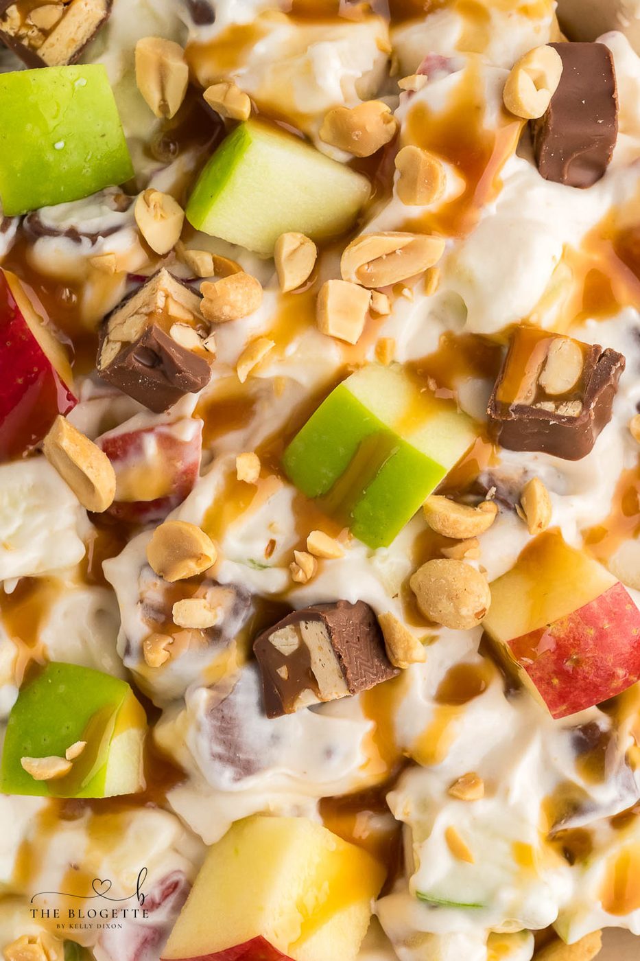 Snickers Apple Salad is a delightful dessert with a combination of apples and Snickers bars in a creamy white chocolate whipped cream sauce.