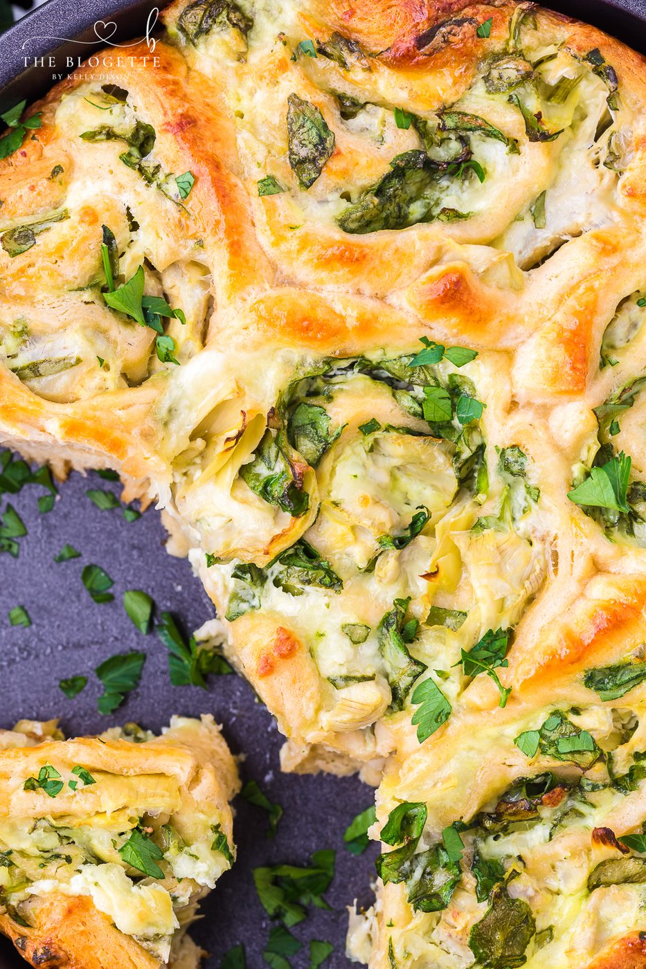 Cheesy Spinach Artichoke Pinwheels are pastry-stuffed rolls baked to perfection. A wonderful appetizer is well-balanced for game day or any event!