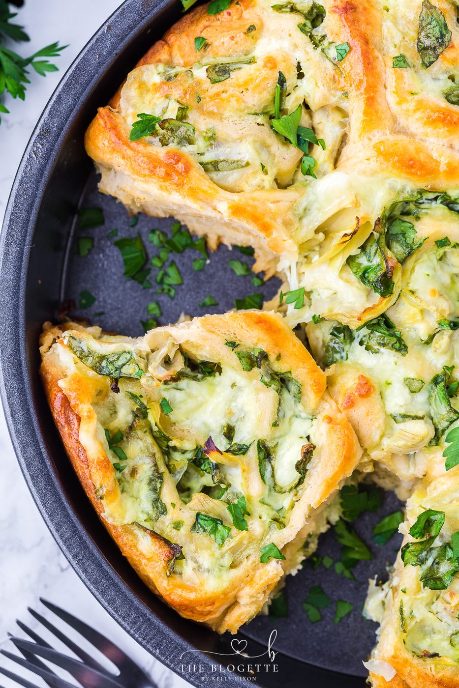 Cheesy Spinach Artichoke Pinwheels are pastry-stuffed rolls baked to perfection. A wonderful appetizer is well-balanced for game day or any event!