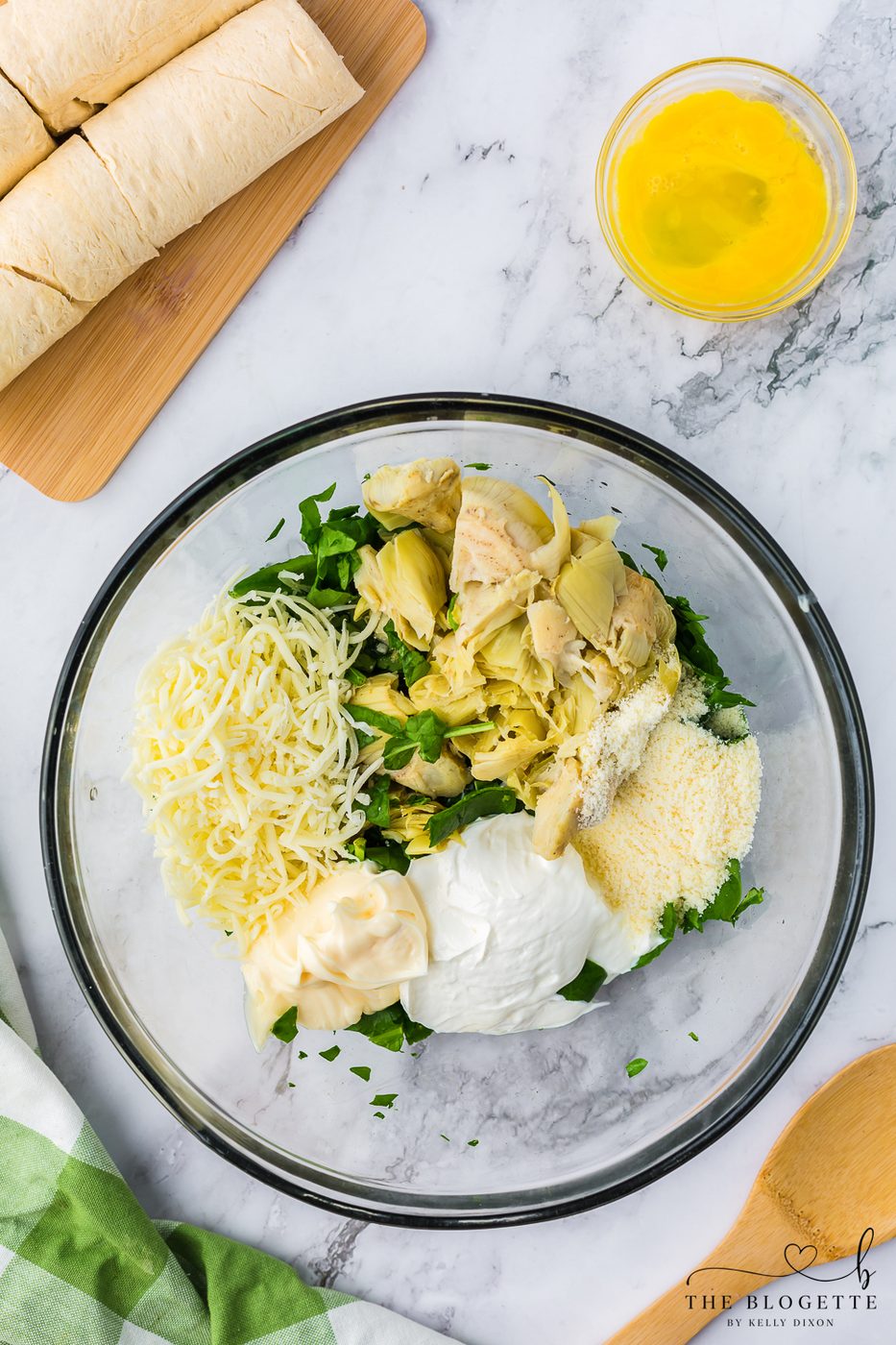 Make the cheesy artichoke stuffing
