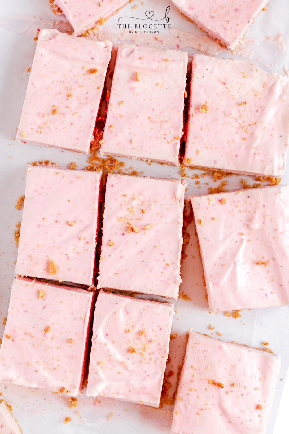 Strawberry Cheesecake Bars start with a graham cracker crust, a layer of cheesecake, and then a no-bake strawberry cheesecake layer.