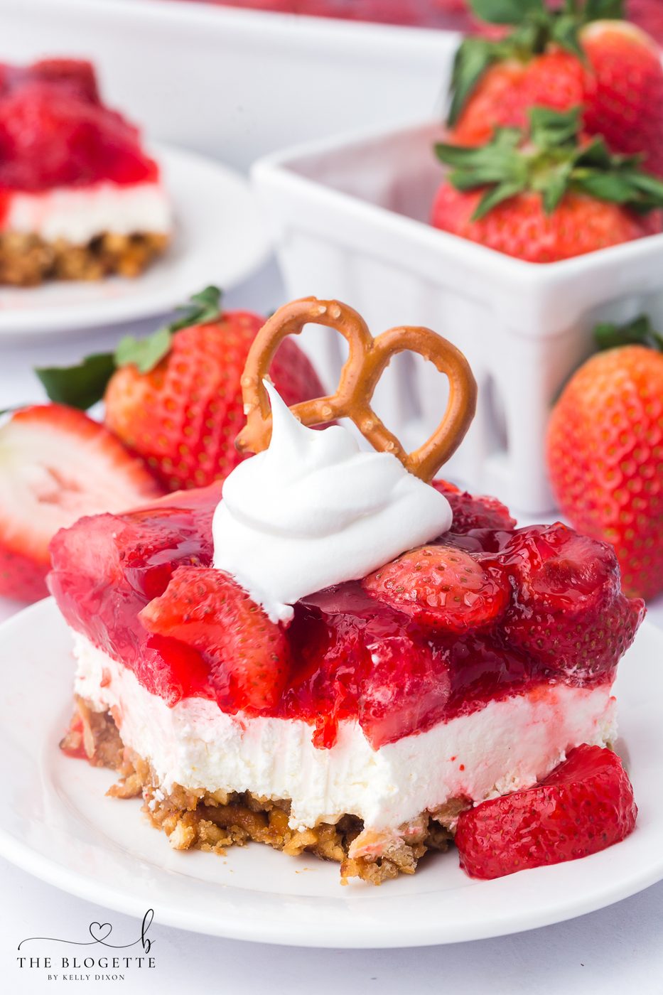 Strawberry Pretzel Salad recipe! Pretzel crust with a creamy layer of cream cheese and whipped topping, topped with Jello and strawberries!