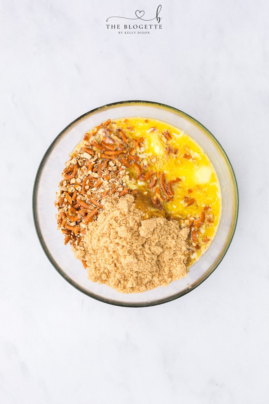stir together the pretzels, melted butter, and light brown sugar