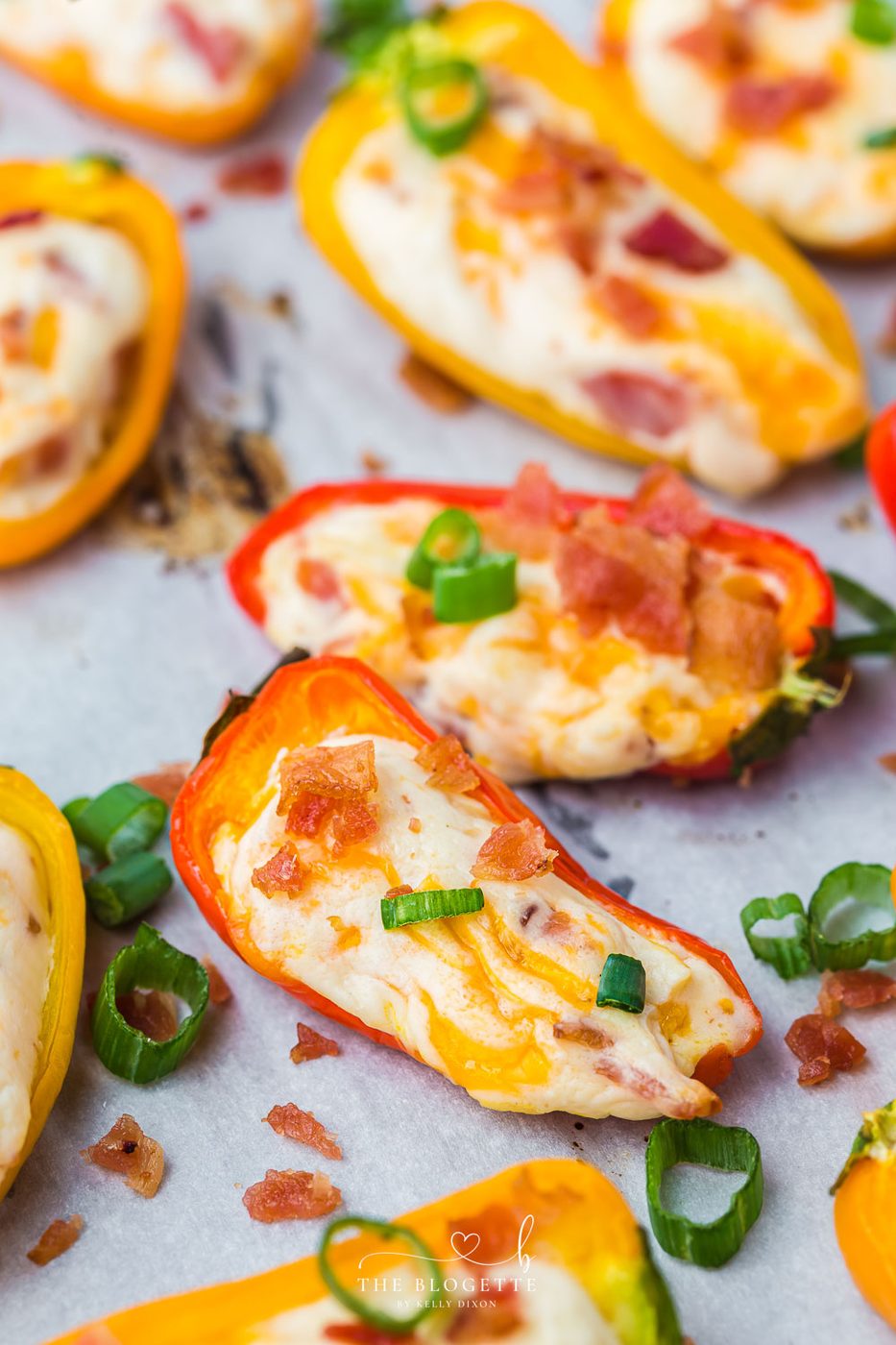 Cheesy Bacon Stuffed Mini Peppers! An straightforward appetizer idea for any gathering! Sweet mini peppers overflowing with cheese, bacon, and more!