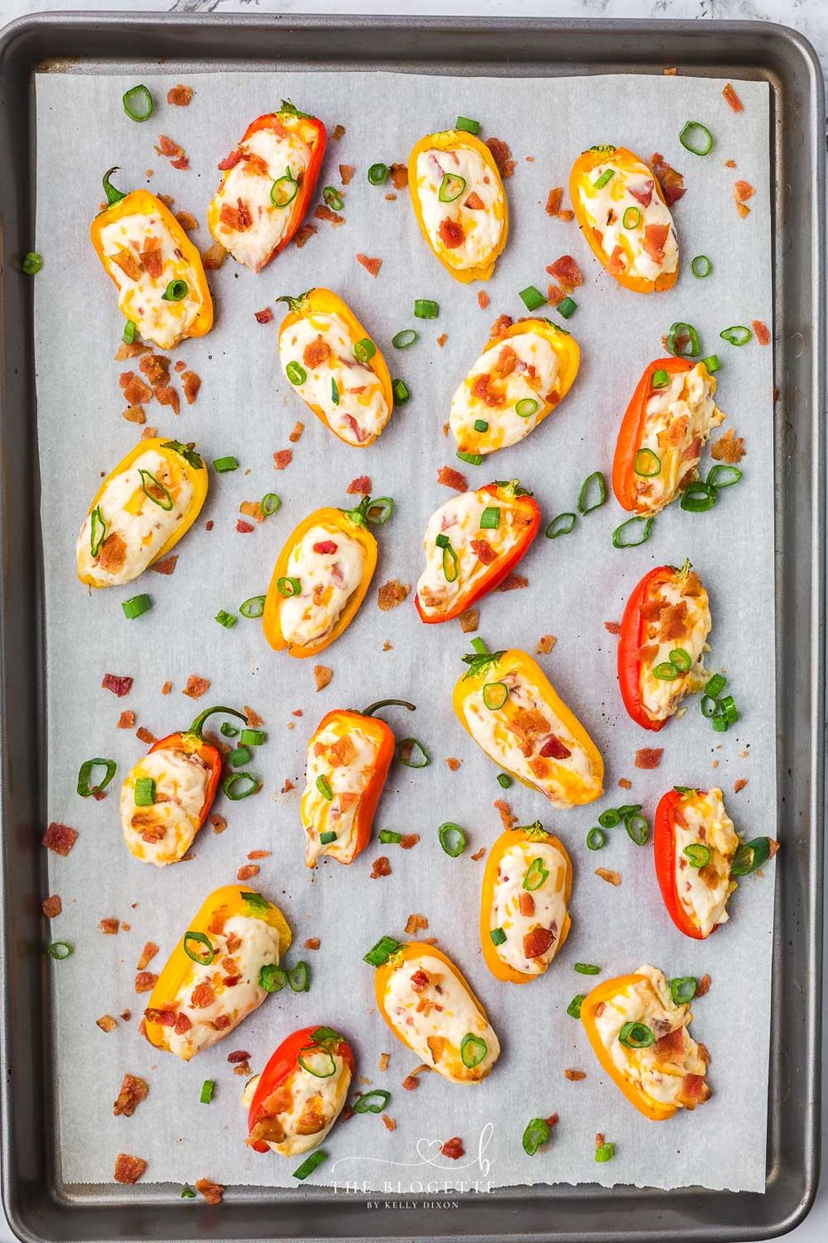 Stuffed peppers on baking sheet