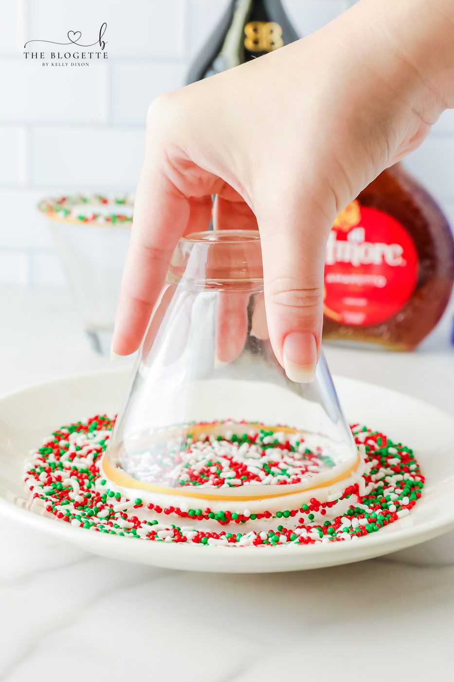 Adding sprinkles to the rim of a cup