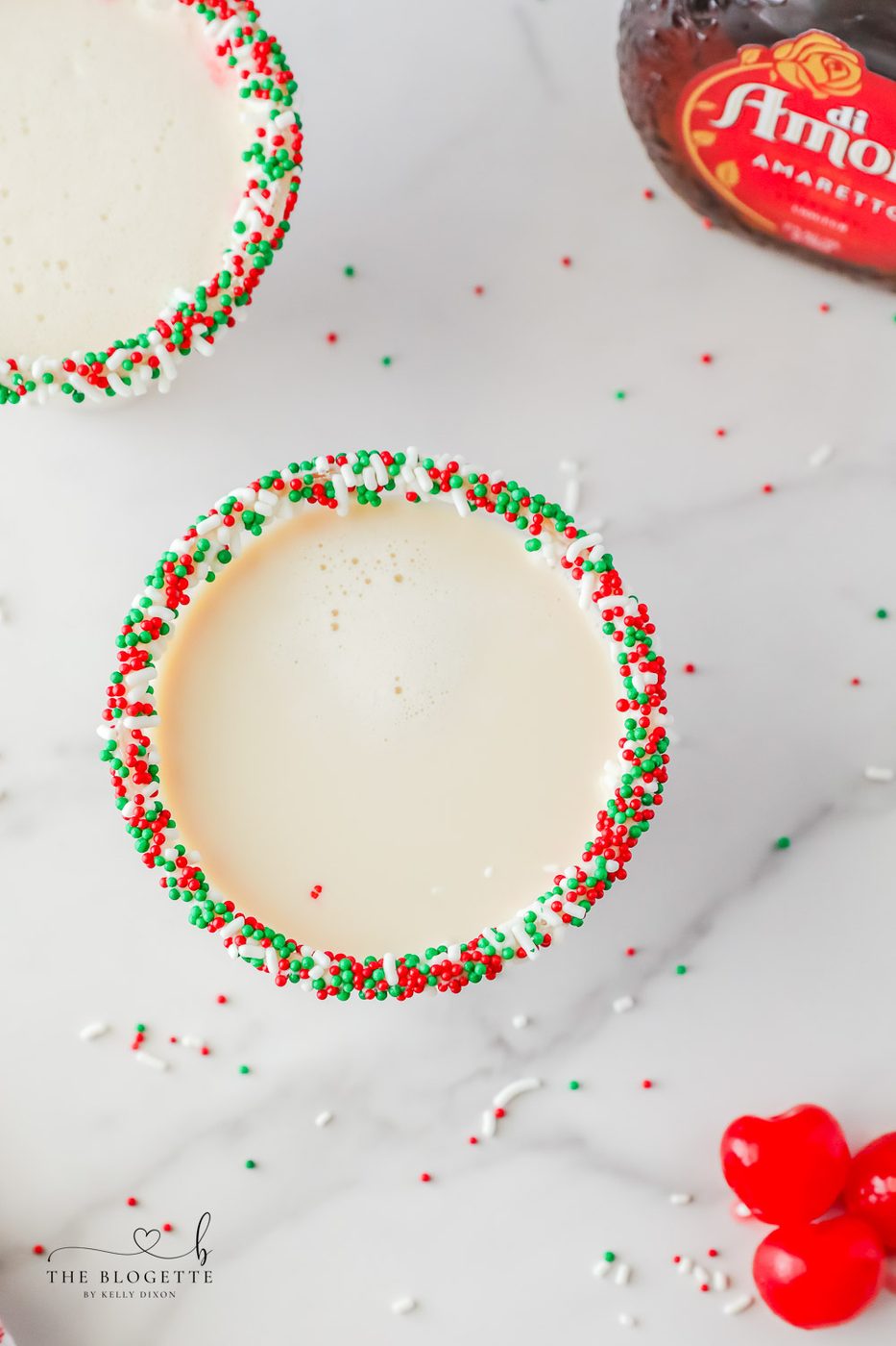 A sugar cookie cocktail for Christmas! Vanilla-rimmed martini glass filled with whipped cream vodka, Irish Cream, and Amaretto.