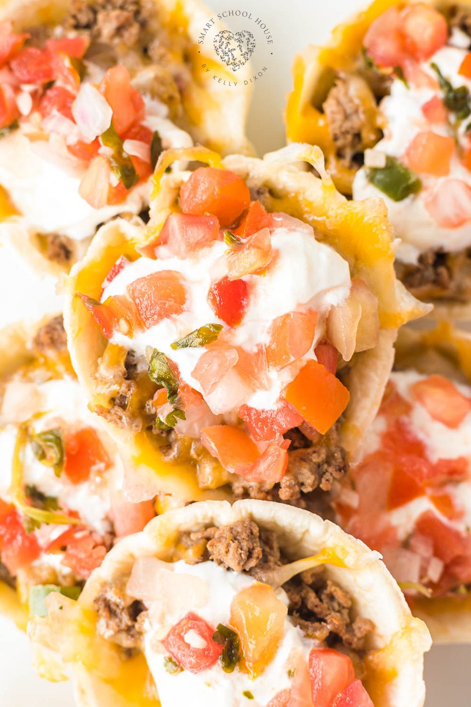 Taco Cups are a great appetizer or twist on Taco Tuesday! Beef and cheese stuffed inside bite-size flour tortillas and baked to perfection.