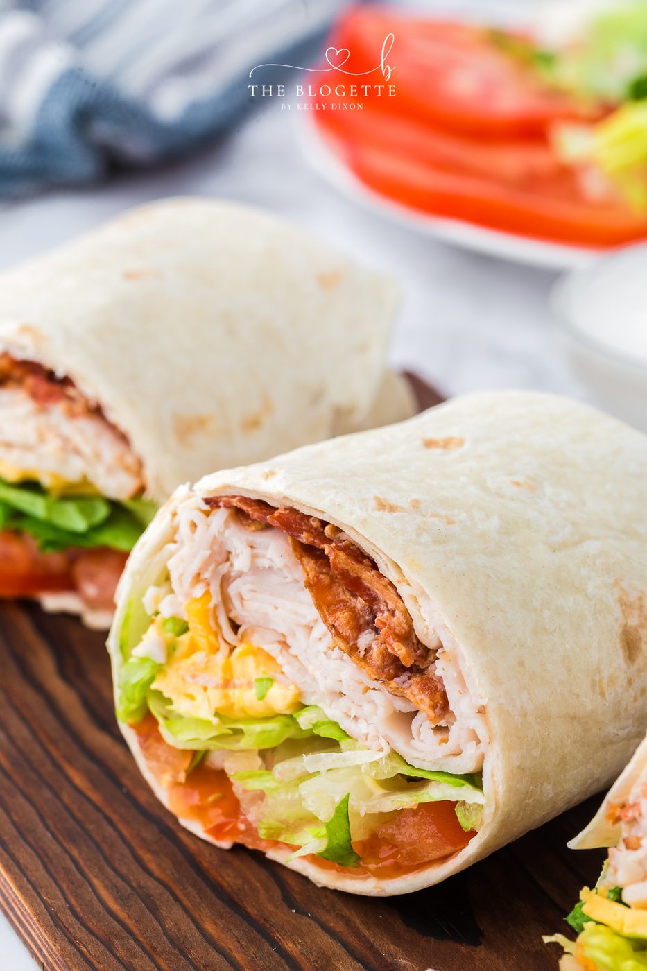 This straightforward Turkey Ranch Club Wrap is just what your lunch hour needs! Turkey, bacon, and cheese, drizzled with ranch dressing!