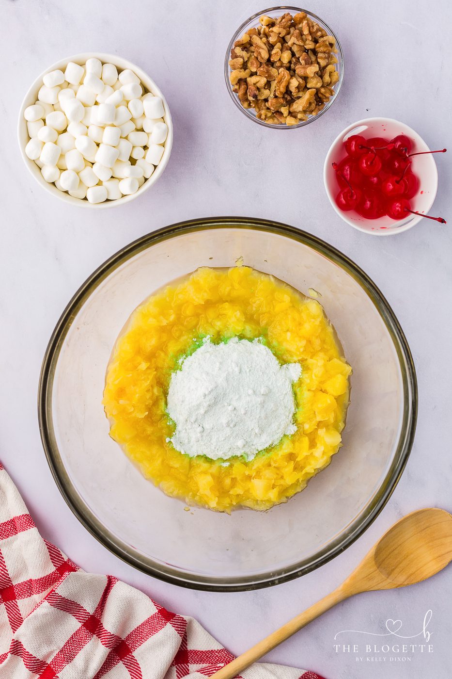 In a large bowl mix the pineapple with the pudding mix