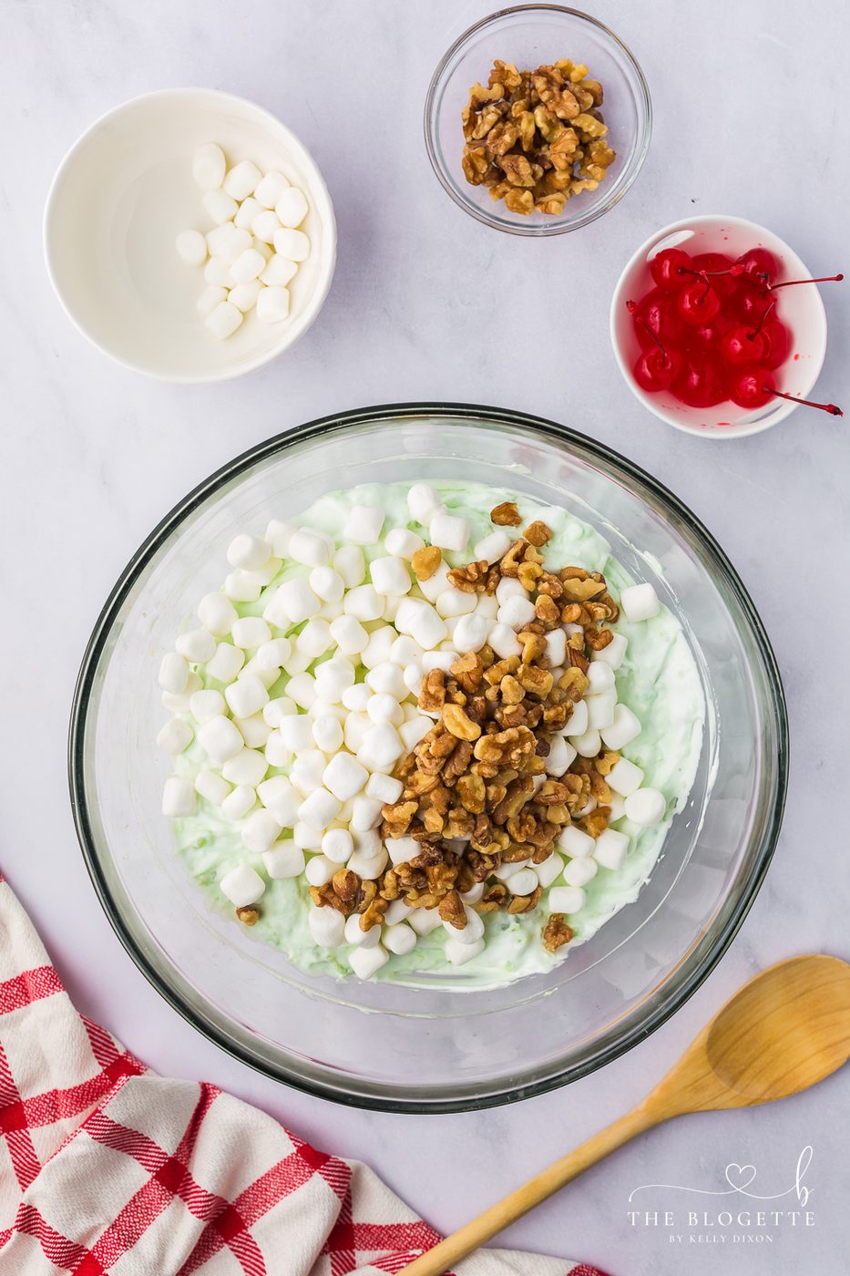 Fold in marshmallows and walnuts