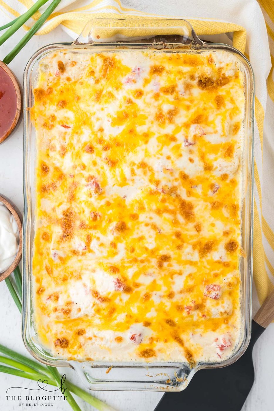 Creamy white enchiladas with cheese on top