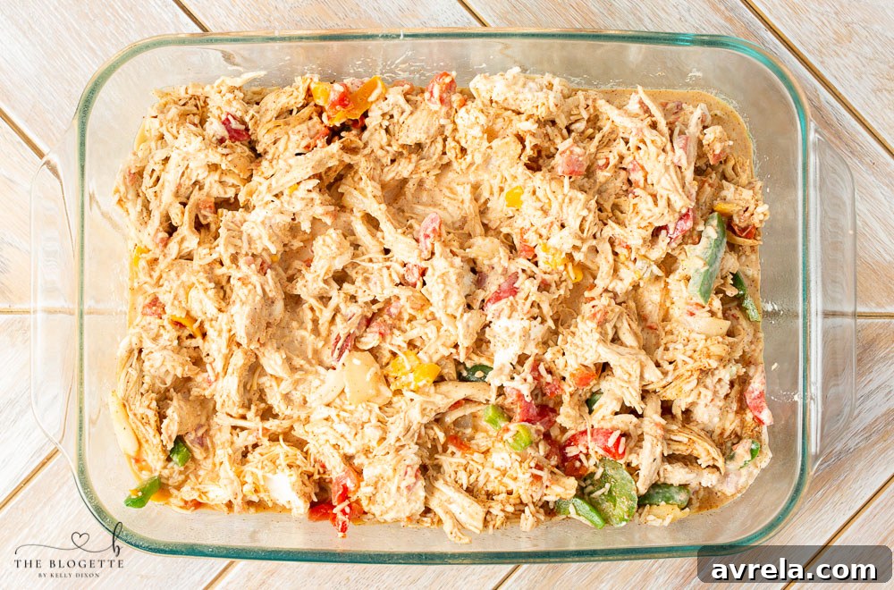 Zesty Chicken Fajita Bake 6 A freshly baked chicken fajita casserole in a 9x13 inch glass baking dish, with melted cheese and a golden crust.