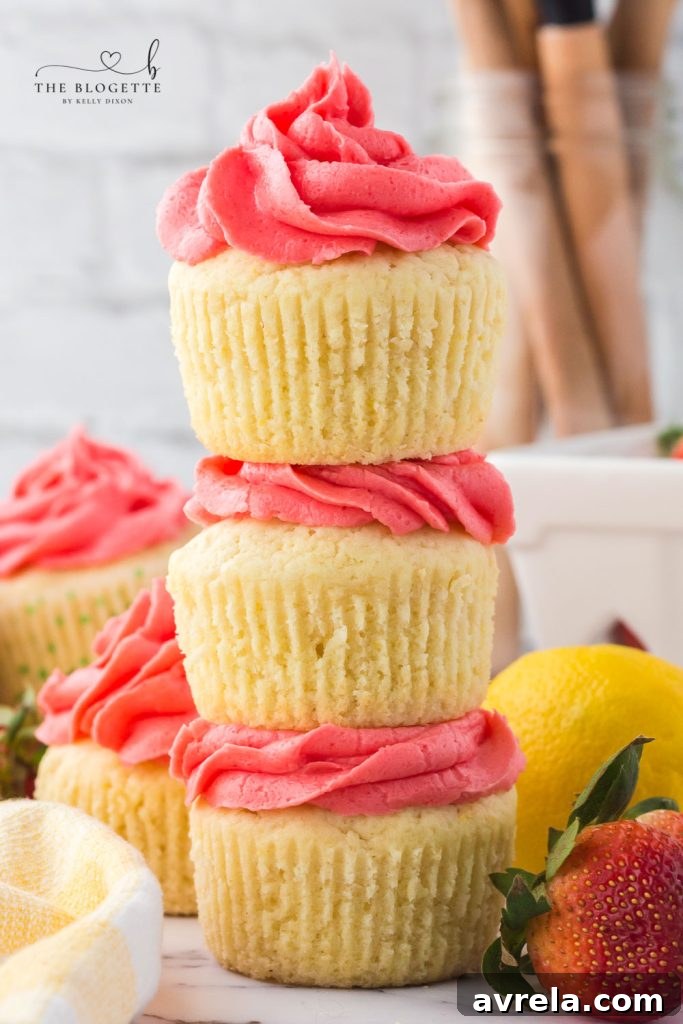 A tray of beautifully decorated Strawberry Lemon Cupcakes, ready for serving.