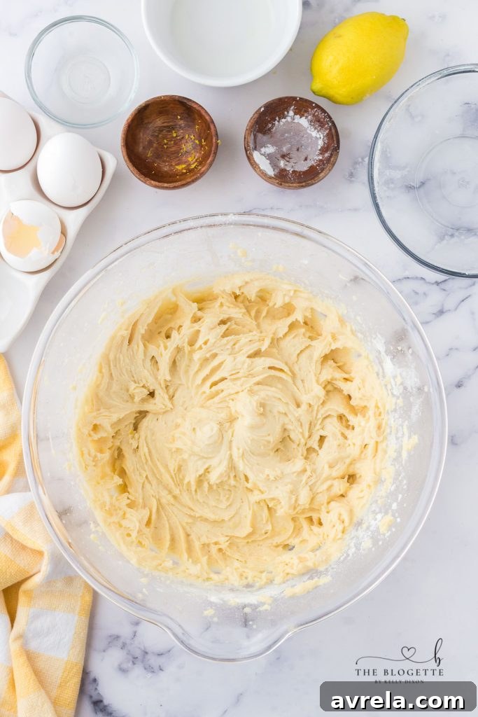 Cupcake batter filled into liners in a baking pan.