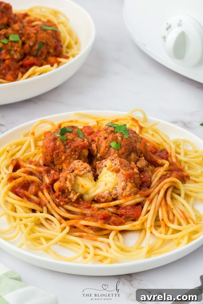 Slow Cooker Cheesy Stuffed Meatball Magic 2 Juicy Crock Pot Cheese Stuffed Meatballs nestled in rich sauce