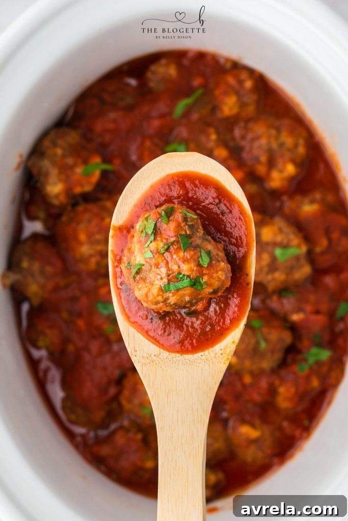 Slow Cooker Cheesy Stuffed Meatball Magic 3 Crock Pot Meatballs Recipe with a close-up of the delicious texture